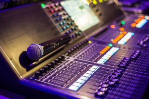 Large modern show sound controller with microphone on it - close up photo